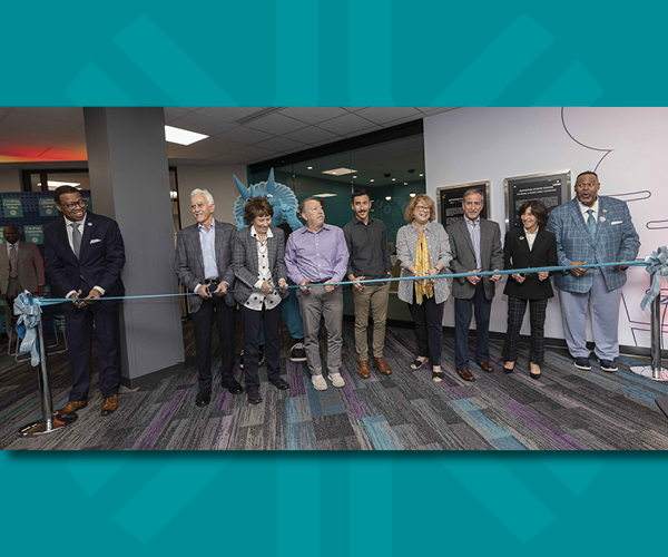 Image of donors and Tri-C leaders cutting a ribbon to The Pantry at the Eastern Campus