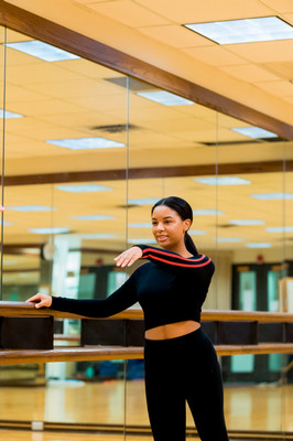 female dancer in tendu derriere with arm forward