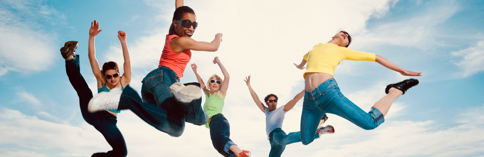 Dancers on rooftop jumping up 