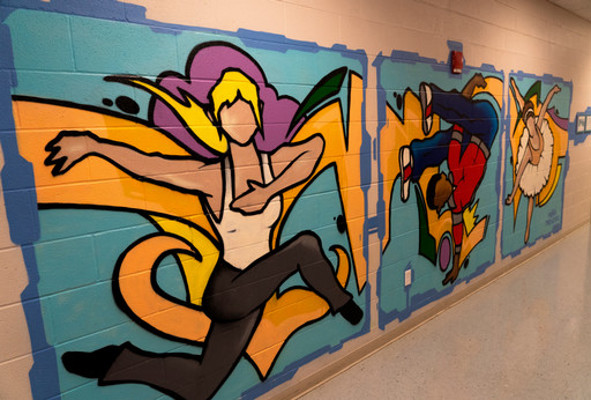 modern dancer painting in hallway