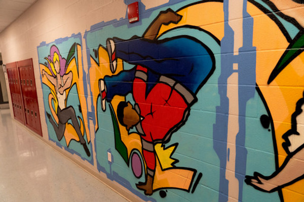 break dancer painting in hallway