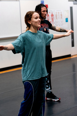 Dance teacher and student doing hip hop arm movement