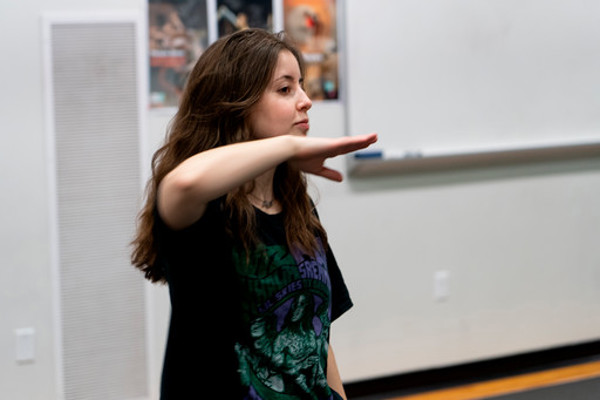 female dancer making angular shape with one arm