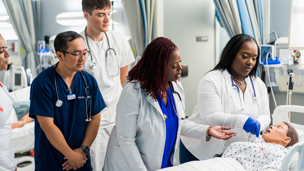 Nursing students and instructor in Nursing simulated patient lab