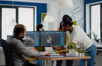 Two people looking at a computer screen